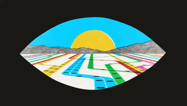 Still from Transit & Traffic video of "eye" graphic opening up on transit lines with sun and mountains in background